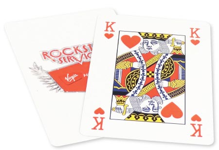 poker playing cards poking out of tuck box.