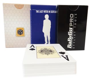Set of 3 poker card games in their tuck boxes. Plastic cards displayed in front.
